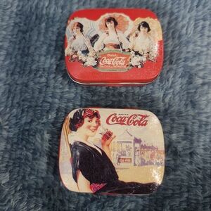 vintage Coca-Cola themed collectible tins, likely produced around 1997